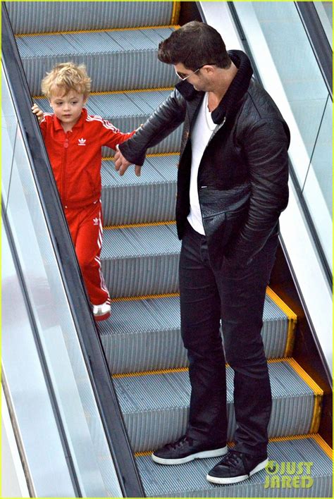 robin thicke is a doting dad holds son julian s hand during outing photo 3051450 celebrity