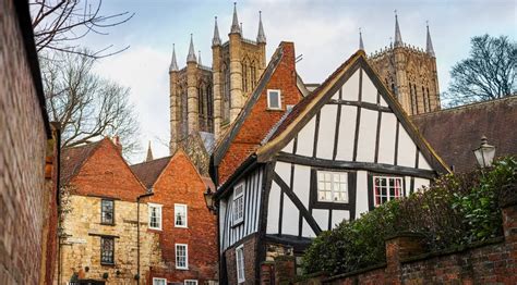 view of the crooked house with lincoln cathedral uk