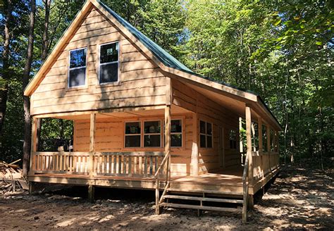 cabin  wraparound porch autumn lodge cabins built   land