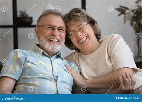 Happy Old Mature Bonding Married Couple Laughing At Funny Joke Stock