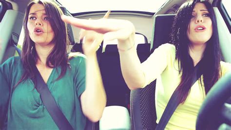 Two Beautiful Women Singing And Dancing Driving Car Stock Footage Video