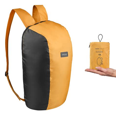 trekking  compact foldable backpack forclaz travel yellow