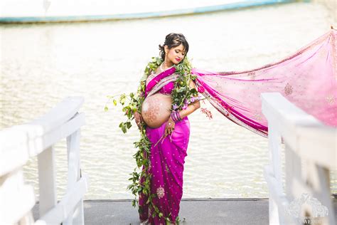 an indian maternity photo shoot with glitters bridal jewellery and