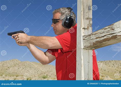 man aiming hand gun  firing range stock image image  profile