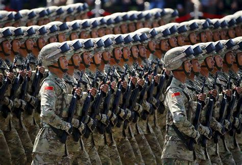 china holds massive military parade  cut troop levels