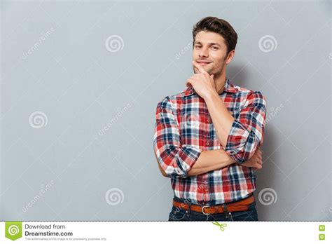 handsome young pensive man standing    stock image image