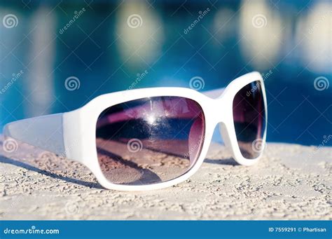 sunglasses laying  swimming pool stock image image  object glass