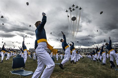 the week s best photos the traditional tossing of the caps and flyover