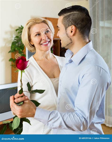 Son Asking Mother To Dance At Home Royalty Free Stock Image