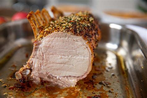 roasted rack of pork is a show stopping holiday main dish crusted with