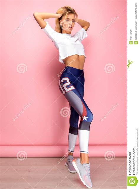 beautiful fitness woman with perfect body in shape wearing sport