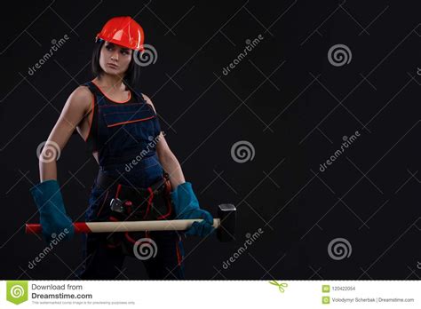 sex equality and feminism girl in safety helmet holding hammer tool