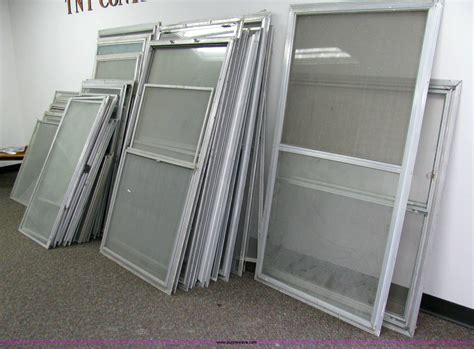 assorted aluminum storm windows  screens  coffeyville ks item  sold purple wave