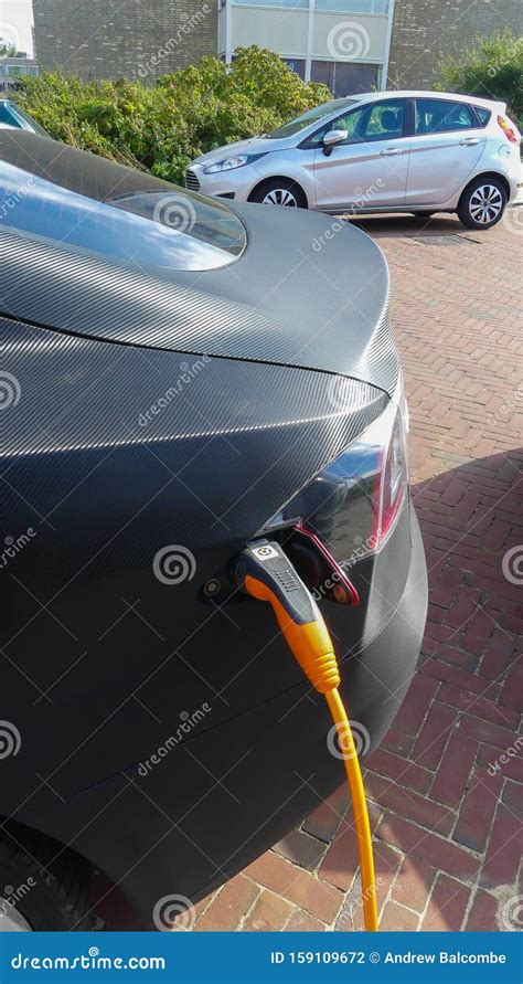 tesla electric car charging batteries  plug  charge station   netherlands editorial