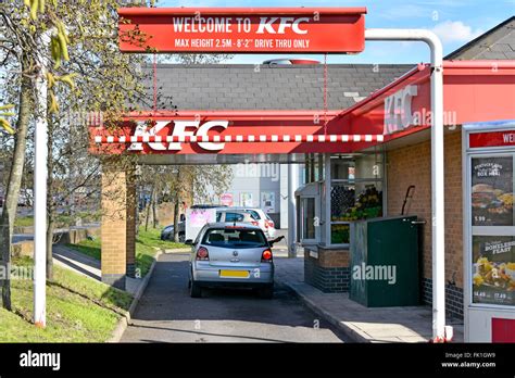 kfc fast food drive  lane  customer  car  ordering stock