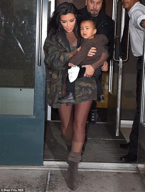 she s upset north looked ready for a nap as kim carried her around