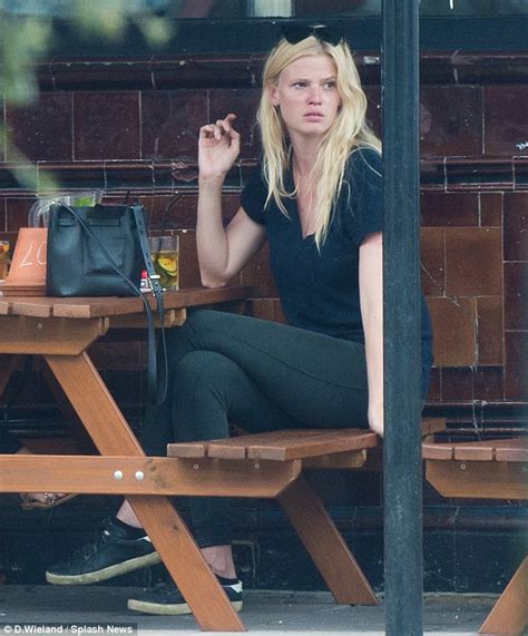 Lara Stone Puffs On A Cigarette As She Joins Pal For A Low