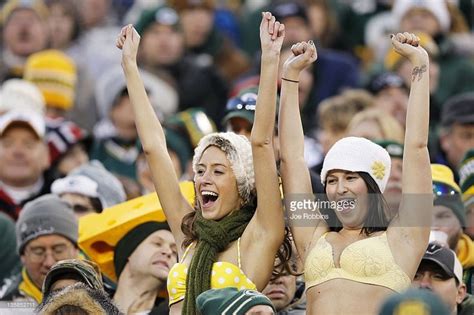A Pair Of Female Green Bay Packers Fans Are Seen Wearing Bikinis