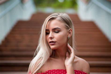 Premium Photo Romantic Blonde Woman With Naked Shoulders Wearing Red