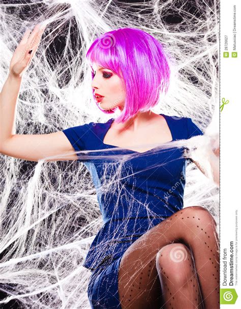 woman with purple wig and intense make up trapped in a