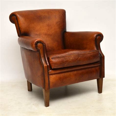 pair  antique distressed leather armchairs interior boutiques