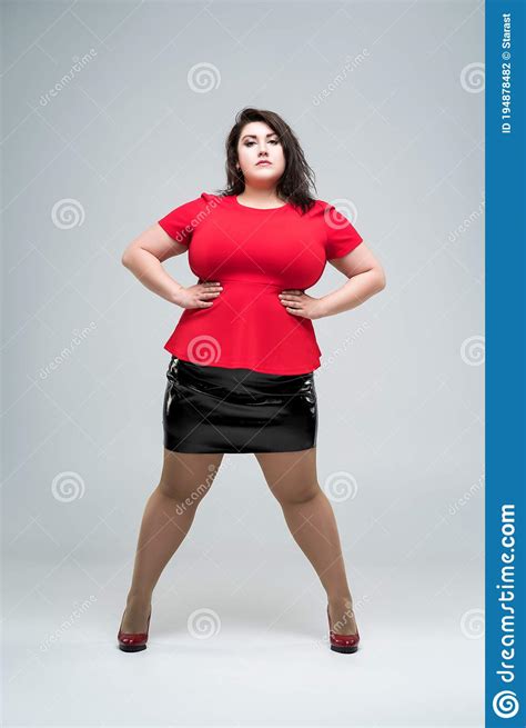 plus size fashion model in red blouse and black skirt fat woman on