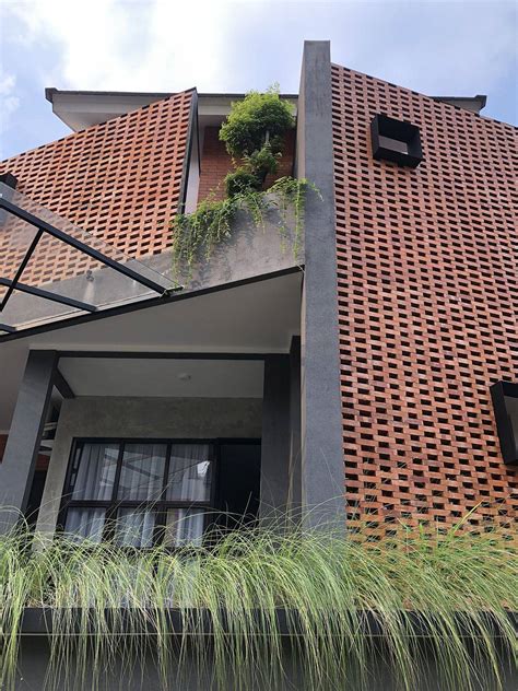 bespoke interlocking brick facade   tropical heat   indonesian home decoist