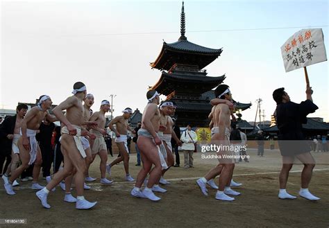 Team Of Japanese Men Wear Loincloths As They Run Around The Saidaiji