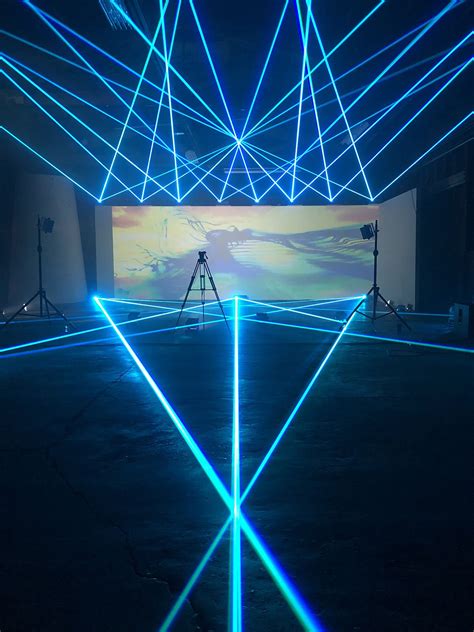 lasers create aerial designs  laser beams  tlc creative booth