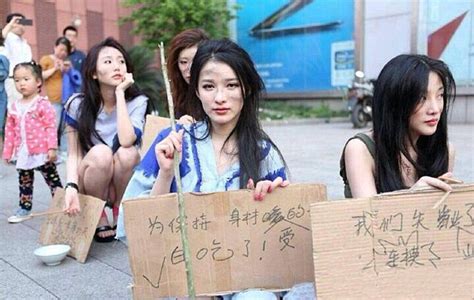 chinese models dress up as beggars after auto shanghai ban daily mail online