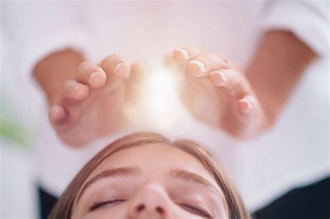 close    relaxed young woman  reiki healing treatment