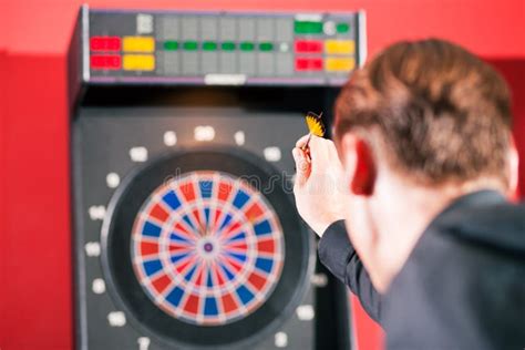 man playing darts stock  image