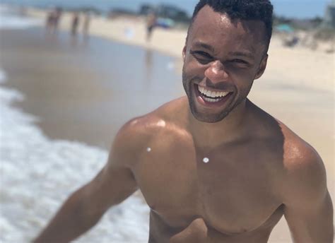 pose s dyllon burnside and his abs wish us a shirtless