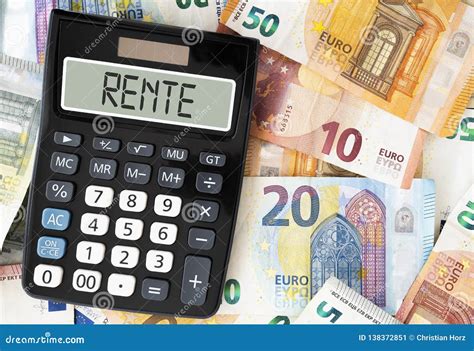 german word rente pension  display  pocket calculator  paper money stock image