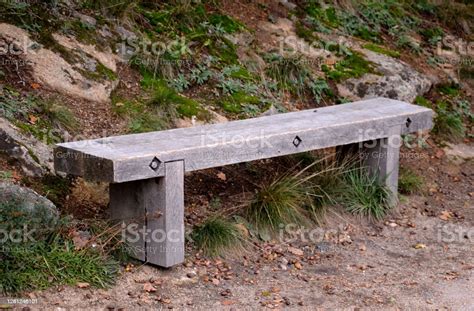 outdoor bench made of oak beams which are connected by solid screws in