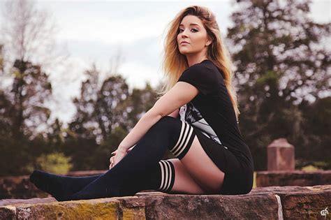 women model looking at viewer thigh highs knee highs