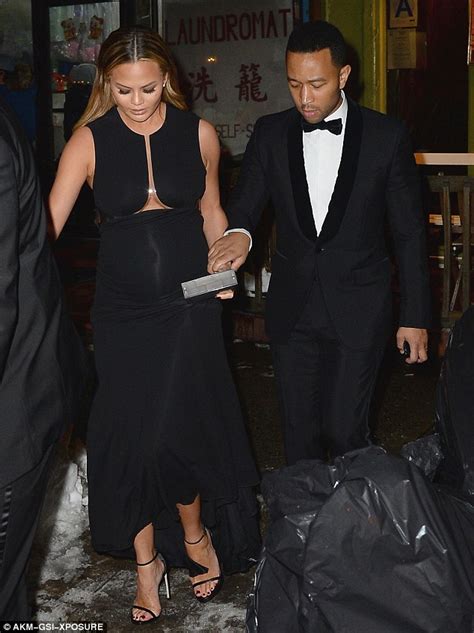 what a gent john legend helps pregnant chrissy teigen navigate the new york snow in her