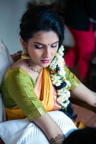 photo of mehendi hairstyle with side braid and mogra strings south