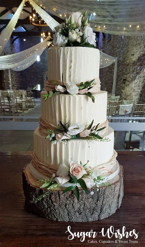 rustic buttercream 4 tier wedding cake with peach and