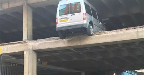 city centre car park collapses  leaves cars  van dangling  upper floors ft