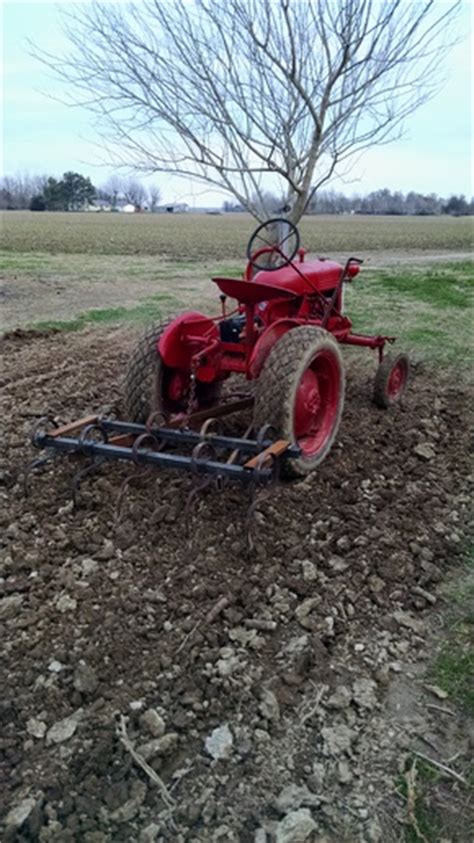 home built field cultivator  cub    tractor shed