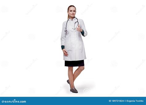 Beautiful Tall Woman Doctor In A Medical White Coat Shows A Gesture