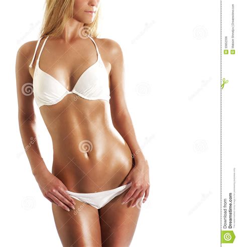 una giovane e donna bionda sexy che posa in uno swimsut bianco fotografia stock immagine di