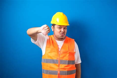 Premium Photo Young Fat Asian Construction Worker Man Wearing Orange