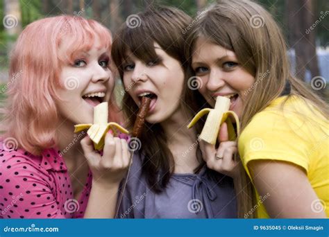 Three Girls Eat A Banana And Sausage Sexually Stock Image Image Of