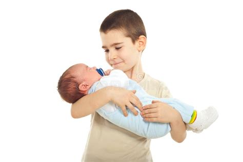 boy holding  newborn brother royalty  stock  image