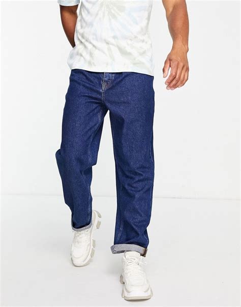 asos design ruimvallende jeans  blauw met donkere wassing asos   jeans asos blauw