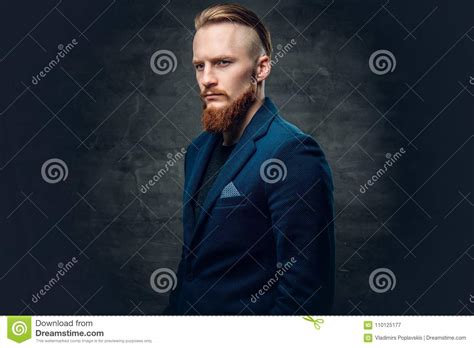 redhead bearded hipster male dressed in a blue jacket