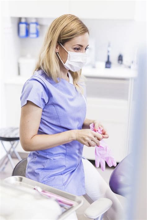 Download Female Dentist Wearing Gloves In Clinic For Free Female
