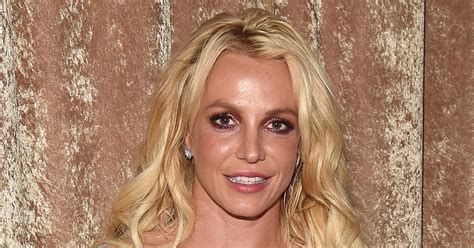 britney spears tells haters to kiss my ass after posing topless e